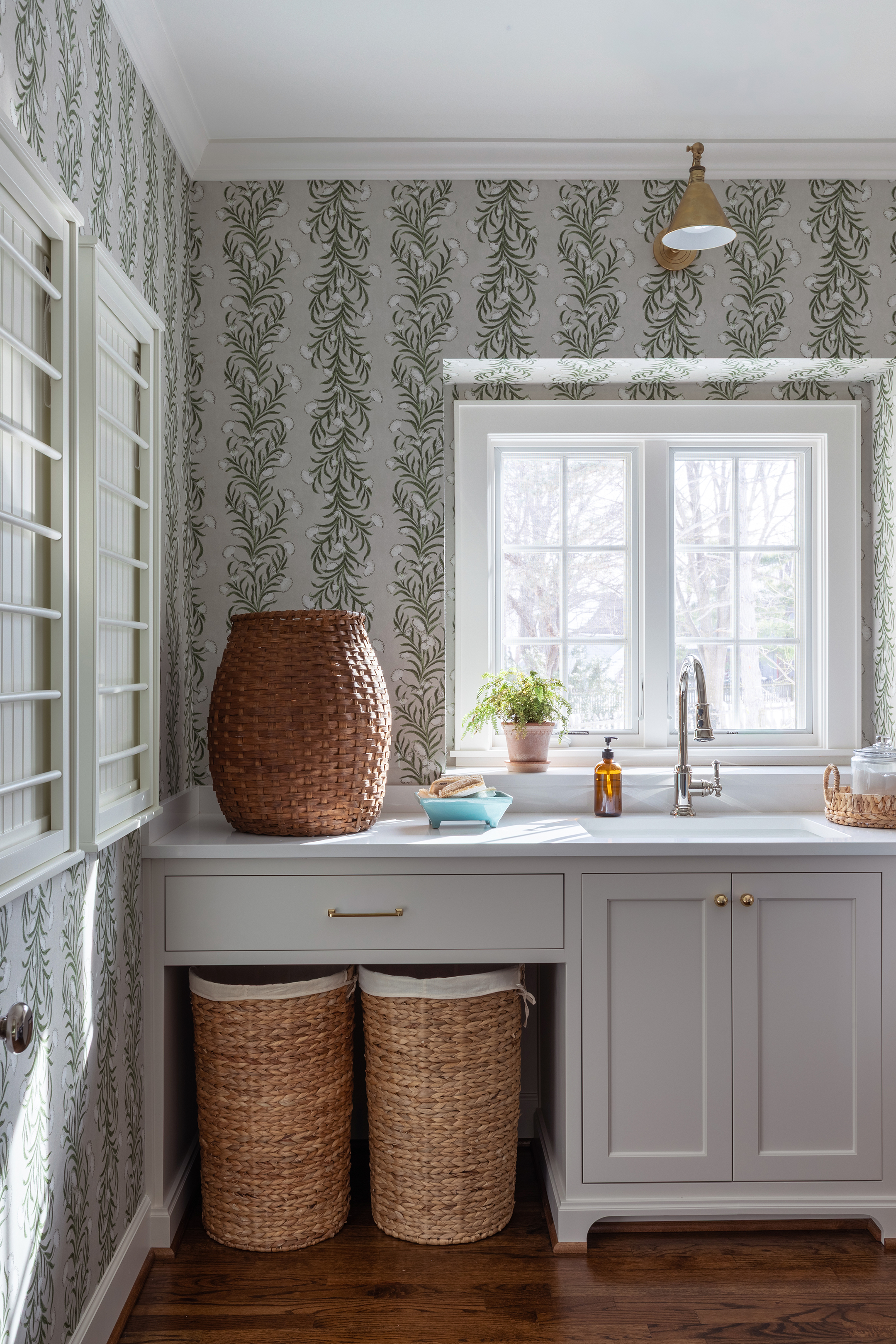 Remodeled laundry room with basket storage 