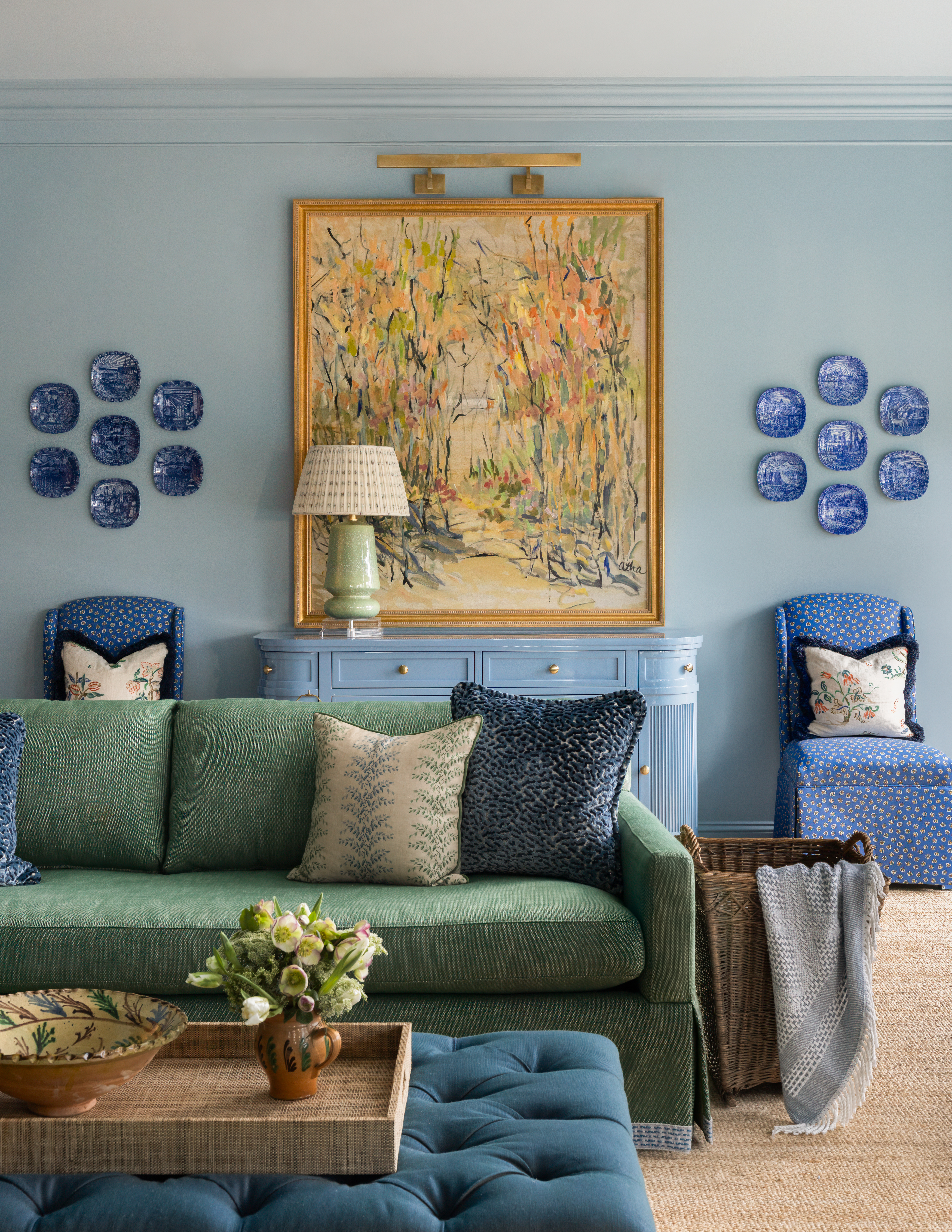 Blue living room with beautiful art 