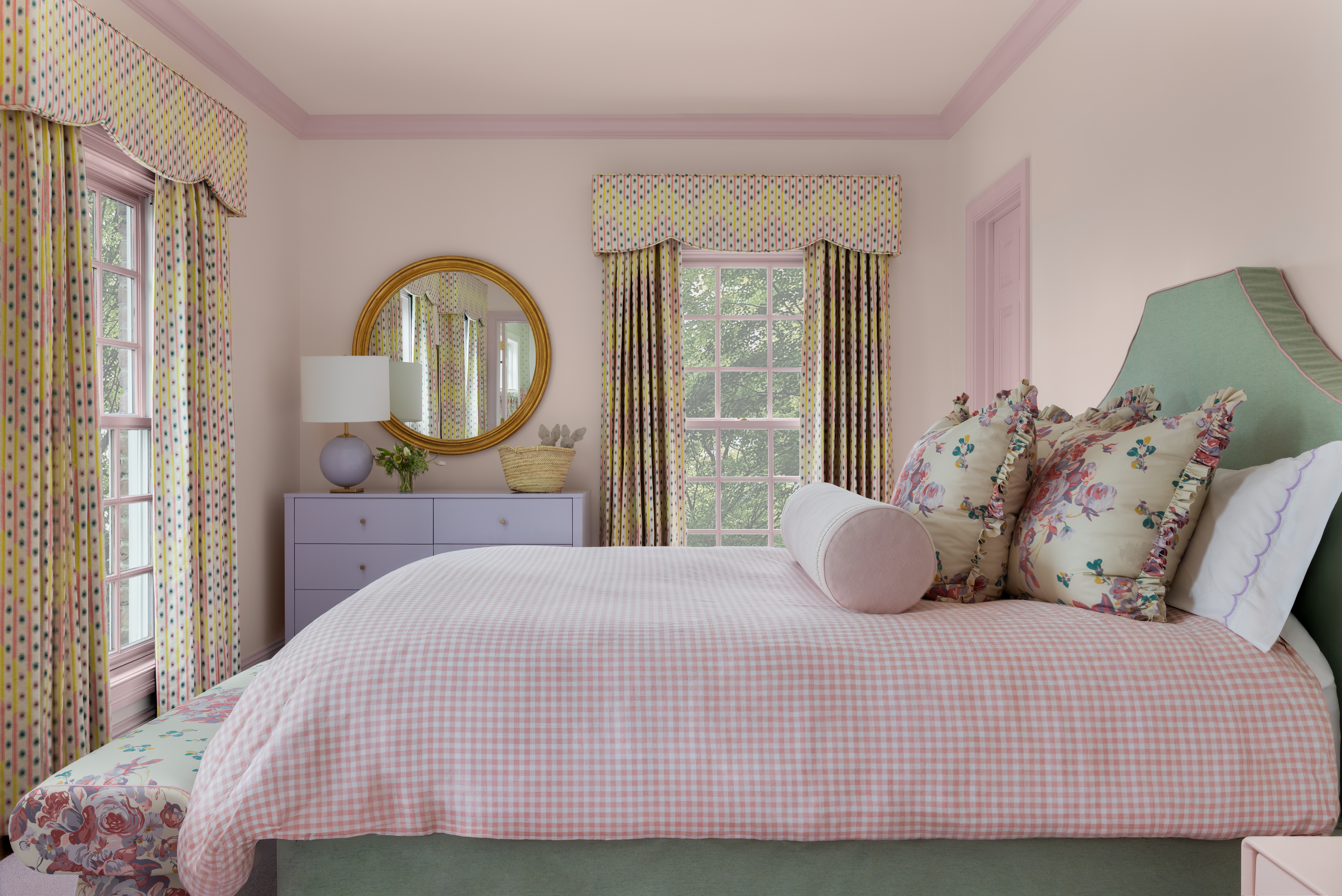 Whimsical pink children's bedroom with floral patterns 