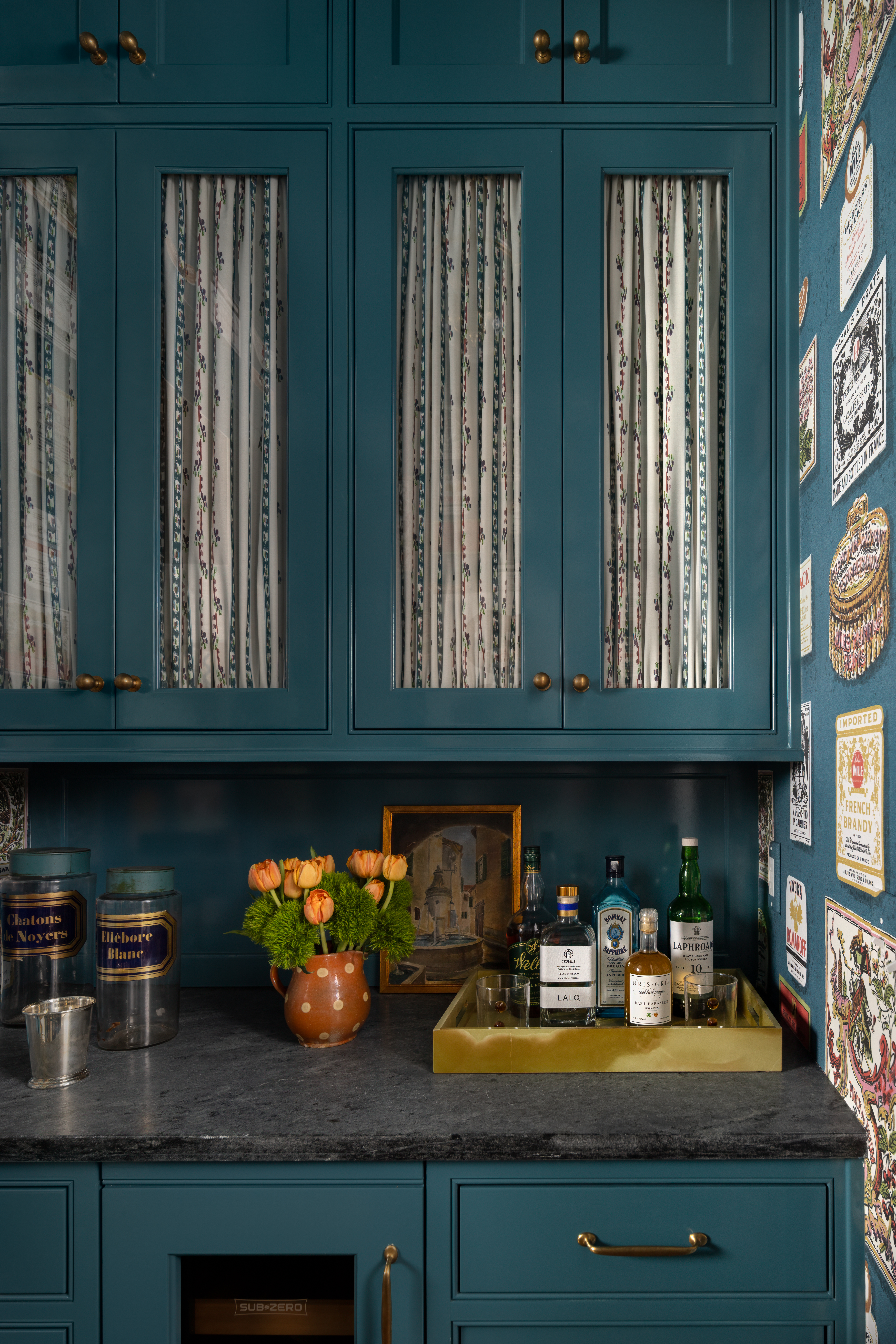 Teal bar with antique brass hardware and soapstone countertop